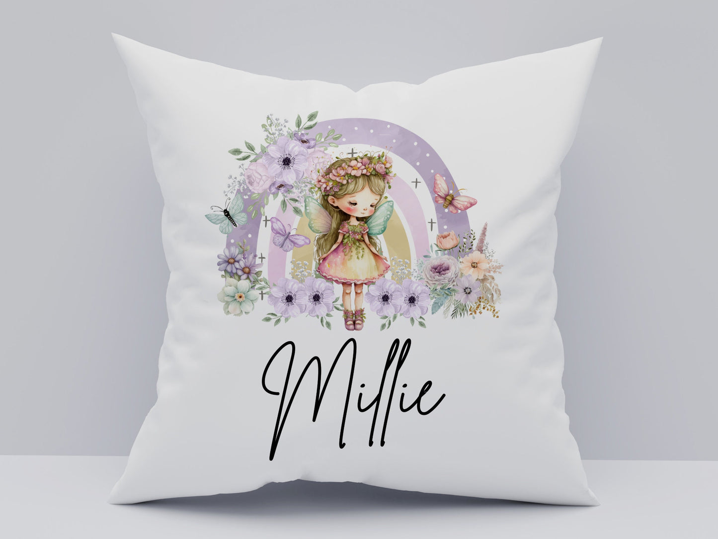 White pillow with a cartoon girl and floral design, featuring the name 'Millie'.